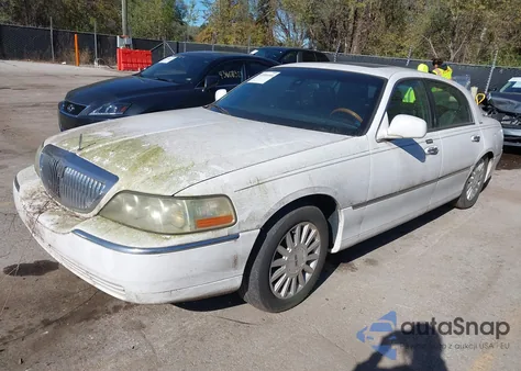 2003 Lincoln Town Car Signature z USA, uszkodzony, nr VIN 1LNHM82W33Y694322